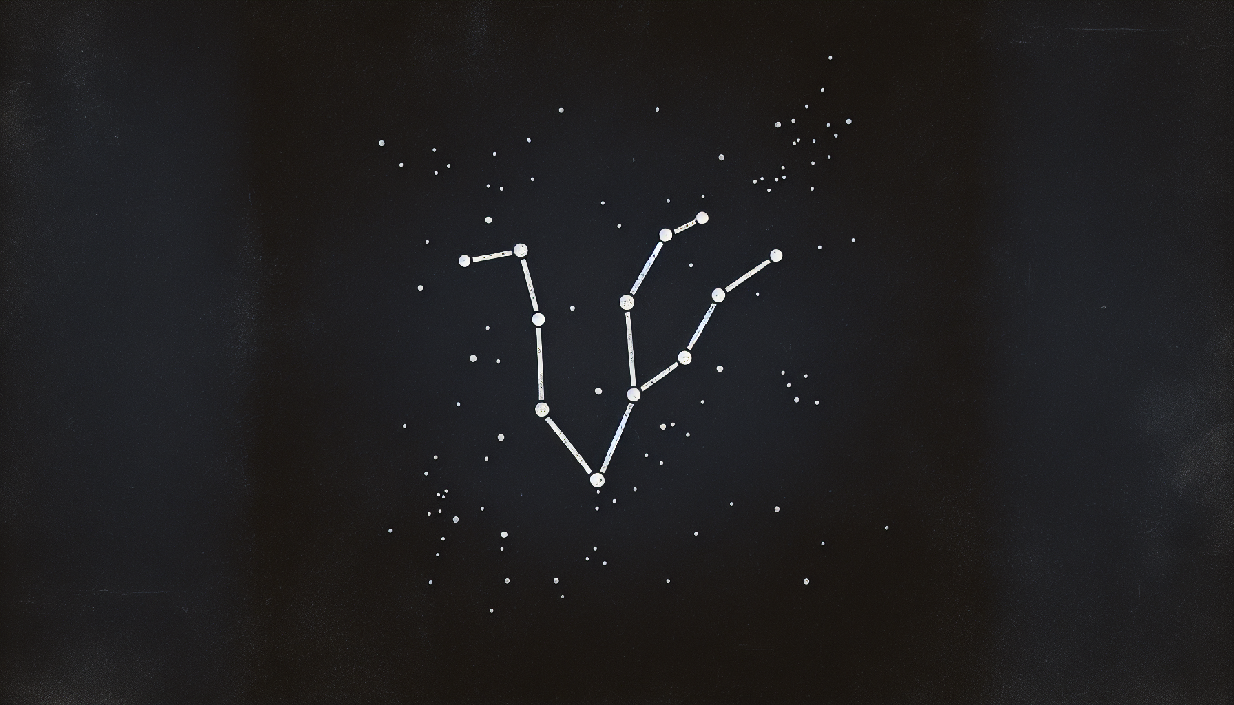 Minimalistic Capricorn constellation on a black textured background.